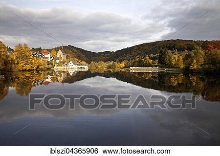 Stock Photograph - lake Beyenburger and historical center of Beyenburg with the St. Mary Magdalene Church in Wuppertal, Bergisches Land, North Rhine-Westphalia, Germany, Europe. Fotosearch