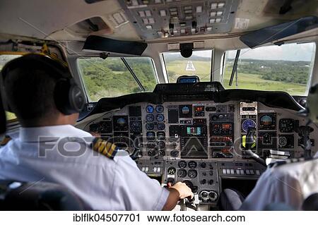Landing, pilot and copilot control the twin-engine propeller aircraft British Aerospace Jetstream 3200, La Isabela International Airport JBQ, Santo Domingo, Dominican Republic, Central America View Large Photo Image Stock Image - Landing, pilot and copilot control the twin-engine propeller aircraft British Aerospace Jetstream 3200, La Isabela International Airport JBQ, Santo Domingo, Dominican Republic, Central America. Fotosearch