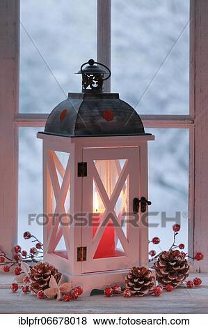 Lantern with Christmas decoration on windowsill View Large Photo Image Stock Photo - Lantern with Christmas decoration on windowsill. Fotosearch