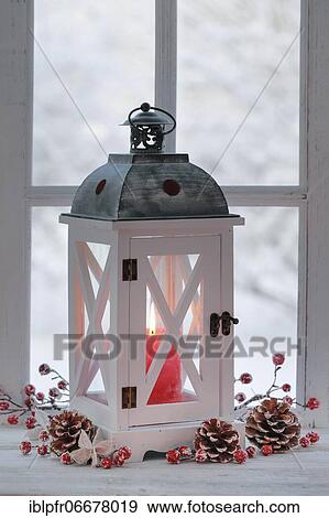 Lantern with Christmas decoration on windowsill View Large Photo Image Stock Photo - Lantern with Christmas decoration on windowsill. Fotosearch