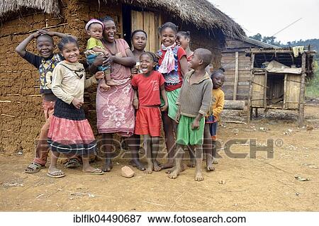 Laughing women and children in front of hut, Berano, Moramanga, Alaotra-Mangoro region, Madagascar, Africa View Large Photo Image Stock Photo - Laughing women and children in front of hut, Berano, Moramanga, Alaotra-Mangoro region, Madagascar, Africa. Fotosearch