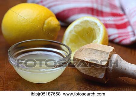 Lemon, lemon juice in peel and lemon squeezer View Large Photo Image Stock Photo - Lemon, lemon juice in peel and lemon squeezer. Fotosearch