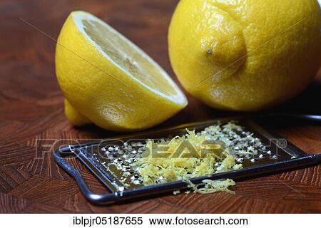 Stock Photography - Lemon, lemon rubbing on grater, lemon peel, lemon rind, lemon rubbing, lemon zest, lemon zests, grated peel. Fotosearch