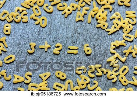 Stock Photography - Letter noodles form arithmetic, mathematics. Fotosearch