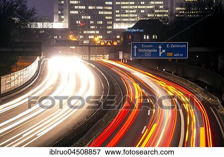 Stock Photo - Light trails at night, A40, Essen, North Rhine-Westphalia, Germany, Europe. Fotosearch