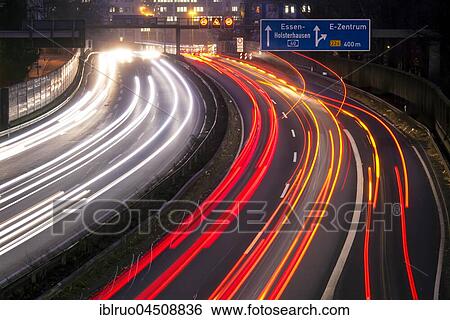 Stock Photograph - Light trails at night, A40, Essen, North Rhine-Westphalia, Germany, Europe. Fotosearch