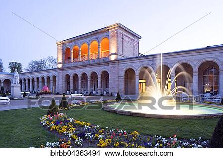 Picture - Lighted Arcade building at dusk, with Rossini-hall and arcade passage, spa garden, architect Friedrich von Gärtner, Bad Kissingen District, Lower Franconia, Bavaria, Germany, Europe. Fotosearch
