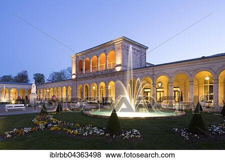 Stock Photo - Lighted Arcade building at dusk, with Rossini-hall and arcade passage, spa garden, architect Friedrich von Gärtner, Bad Kissingen District, Lower Franconia, Bavaria, Germany, Europe. Fotosearch