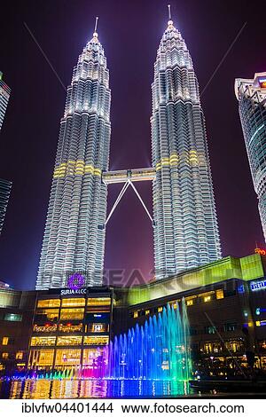 Lighted Petronas Towers with multicolored fountain at night, Kuala Lumpur, Malaysia, Asia View Large Photo Image Picture - Lighted Petronas Towers with multicolored fountain at night, Kuala Lumpur, Malaysia, Asia. Fotosearch