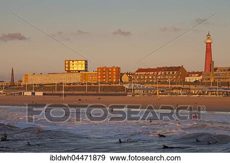 Stock Photo - Lighthouse on beach behind buildings, Scheveningen, The Hague, Holland, The Netherlands, Europe. Fotosearch