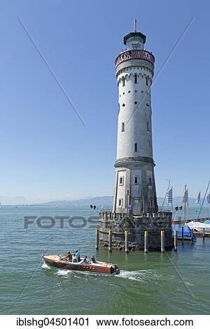Lighthouse with boat, harbor, Lindau, Lake Constance, Bavaria, Germany, Europe View Large Photo Image Stock Image - Lighthouse with boat, harbor, Lindau, Lake Constance, Bavaria, Germany, Europe. Fotosearch