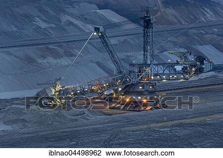 Lignite opencast mine at night, stacker, Garzweiler, North Rhine-Westphalia, Germany, Europe View Large Photo Image Stock Image - Lignite opencast mine at night, stacker, Garzweiler, North Rhine-Westphalia, Germany, Europe. Fotosearch