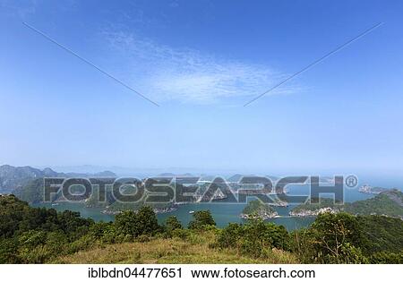 Stock Image - Limestone karst formations in Lan Ha Bay, Halong Bay, Vietnam, Asia. Fotosearch