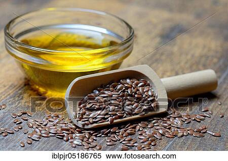 Stock Photography - Linseed ( Linum usitatissimum) in shovel and linseed oil. Fotosearch