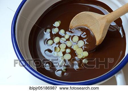 Liquid chocolate coating and melting cocoa butter with spoon( Theobroma cacao), oleum cacao View Large Photo Image Stock Photo - Liquid chocolate coating and melting cocoa butter with spoon( Theobroma cacao), oleum cacao. Fotosearch
