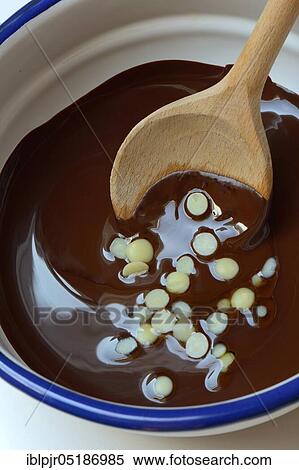 Liquid chocolate coating and melting cocoa butter with spoon( Theobroma cacao), oleum cacao View Large Photo Image Stock Photography - Liquid chocolate coating and melting cocoa butter with spoon( Theobroma cacao), oleum cacao. Fotosearch