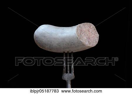 Stock Image - Liver sausage on fork, homemade liver sausage. Fotosearch