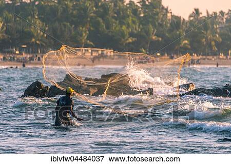 Local fisherman casts fishing net, Chaung Thar Beach, Bay of Bengal, Ayeyarwady, Myanmar, Asia View Large Photo Image Stock Photo - Local fisherman casts fishing net, Chaung Thar Beach, Bay of Bengal, Ayeyarwady, Myanmar, Asia. Fotosearch