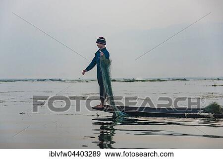 Local fisherman leg rower with wooden boat, Inle Lake, Inle Lake, Shan State, Myanmar, Asia View Large Photo Image Stock Photo - Local fisherman leg rower with wooden boat, Inle Lake, Inle Lake, Shan State, Myanmar, Asia. Fotosearch