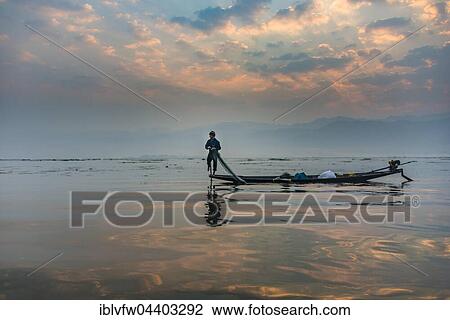 Local Intha fisherman rowing boat with one leg, unique local practice, sunrise, dawn, Inle Lake, Shan State, Myanmar, Asia View Large Photo Image Stock Image - Local Intha fisherman rowing boat with one leg, unique local practice, sunrise, dawn, Inle Lake, Shan State, Myanmar, Asia. Fotosearch