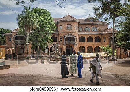Locals outside Sultan Palace, Foumban, West Region, Cameroon, Africa View Large Photo Image Stock Photo - Locals outside Sultan Palace, Foumban, West Region, Cameroon, Africa. Fotosearch