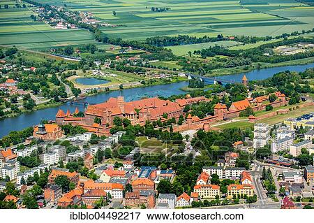 Malbork castle, brick gothic, Nogat River, Malbork city, seat of the Grand Master of the Teutonic Order, German Teutonic Knights, Pomorskie, Poland, Europe View Large Photo Image Stock Photo - Malbork castle, brick gothic, Nogat River, Malbork city, seat of the Grand Master of the Teutonic Order, German Teutonic Knights, Pomorskie, Poland, Europe. Fotosearch