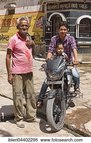 Man and child on motorcycle with older man, Bera, Rajasthan, India, Asia View Large Photo Image Stock Photography - Man and child on motorcycle with older man, Bera, Rajasthan, India, Asia. Fotosearch