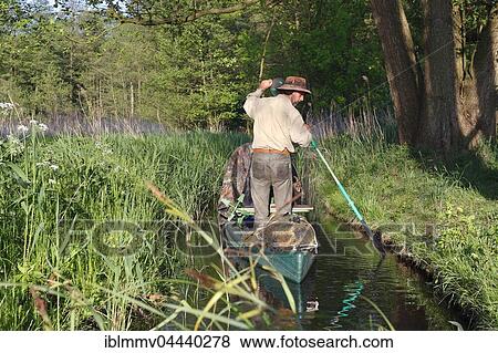 Man rowing in canoe, Müritz National Park, Mecklenburg-Western Pomerania, Germany, Europe View Large Photo Image Stock Photo - Man rowing in canoe, Müritz National Park, Mecklenburg-Western Pomerania, Germany, Europe. Fotosearch