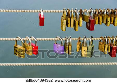 Many colorful locks are locked at a steel cable for a love vow, Bamberg, Bavaria, Germany, Europe View Large Photo Image Stock Image - Many colorful locks are locked at a steel cable for a love vow, Bamberg, Bavaria, Germany, Europe. Fotosearch