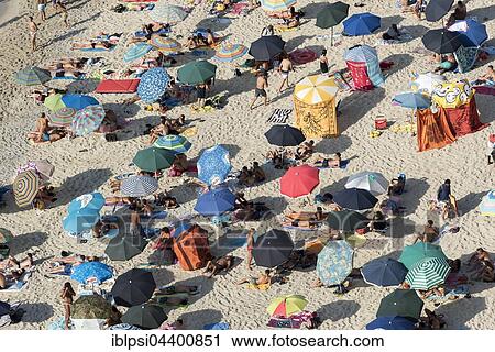 Many people with colorful sunshades at Tropea Beach, Calabria, Italy, Europe View Large Photo Image Stock Image - Many people with colorful sunshades at Tropea Beach, Calabria, Italy, Europe. Fotosearch