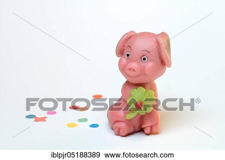Stock Photo - Marzipan lucky pig, New Year, New Year wishes. Fotosearch