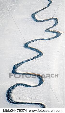 Picture - Meandering river Möhne in the snow, Hunderbecke, Brilon, Sauerland, North Rhine-Westphalia, Germany, Europe. Fotosearch