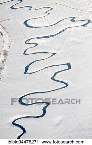 Stock Image - Meandering river Möhne in the snow, Hunderbecke, Brilon, Sauerland, North Rhine-Westphalia, Germany, Europe. Fotosearch