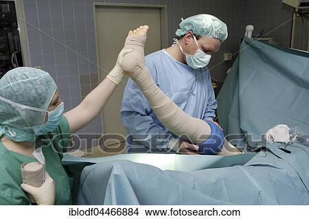 Medical team during operation, pulling varicose veins, vascular surgery, Düsseldorf, North Rhine-Westphalia, Germany, Europe View Large Photo Image Picture - Medical team during operation, pulling varicose veins, vascular surgery, Düsseldorf, North Rhine-Westphalia, Germany, Europe. Fotosearch