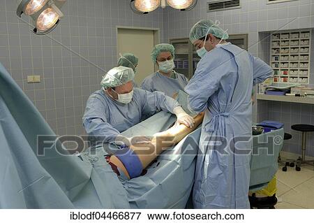Medical team during operation, pulling varicose veins, vascular surgery, Düsseldorf, North Rhine-Westphalia, Germany, Europe View Large Photo Image Stock Photo - Medical team during operation, pulling varicose veins, vascular surgery, Düsseldorf, North Rhine-Westphalia, Germany, Europe. Fotosearch