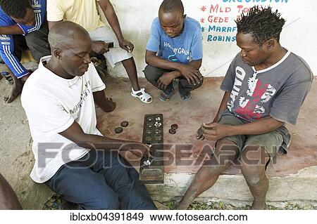 Men playing Bao board game, Watamu, Kilifi County, Kenya, Africa View Large Photo Image Stock Photo - Men playing Bao board game, Watamu, Kilifi County, Kenya, Africa. Fotosearch