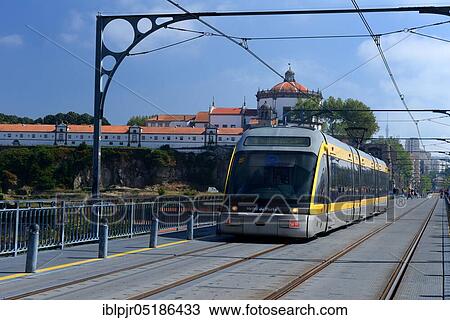Stock Image - Metro on bridge Ponte de D. Luis I, former Augustinian monastery Serra do Pilar, Porto, Portugal, Europe. Fotosearch