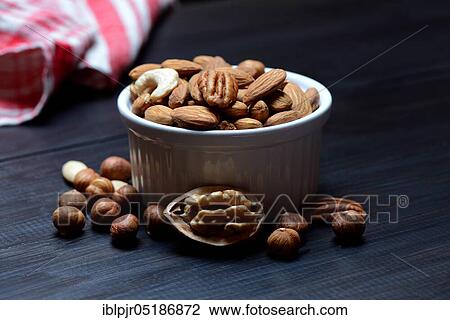 Mixed nuts in shell, nut mix, nut mixture, walnut, pecan, hazelnut, hazelnuts, cashew nuts, almonds View Large Photo Image Stock Image - Mixed nuts in shell, nut mix, nut mixture, walnut, pecan, hazelnut, hazelnuts, cashew nuts, almonds. Fotosearch