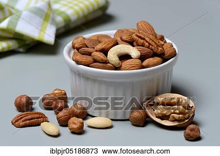 Mixed nuts in shell, nut mix, nut mixture, walnut, pecan, hazelnut, hazelnuts, cashew nuts, almonds View Large Photo Image Stock Image - Mixed nuts in shell, nut mix, nut mixture, walnut, pecan, hazelnut, hazelnuts, cashew nuts, almonds. Fotosearch
