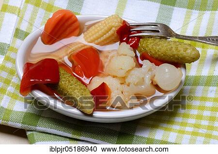 Mixed pickles with carrots, cauliflower, gherkins, onions and corn onions in a bowl with fork, pickled, pickled, pickled gherkin View Large Photo Image Stock Image - Mixed pickles with carrots, cauliflower, gherkins, onions and corn onions in a bowl with fork, pickled, pickled, pickled gherkin. Fotosearch