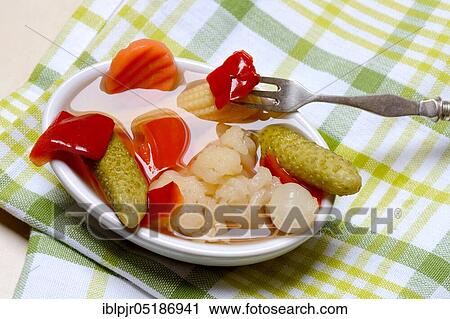 Mixed pickles with carrots, cauliflower, gherkins, onions and corn onions in a bowl with fork, pickled, pickled, pickled gherkin View Large Photo Image Stock Image - Mixed pickles with carrots, cauliflower, gherkins, onions and corn onions in a bowl with fork, pickled, pickled, pickled gherkin. Fotosearch