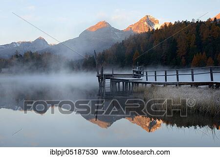 Morning atmosphere at Lake Staz near St. Moritz, Lej da, Upper Engadine, Engadine, Canton Graubünden, Switzerland, Europe View Large Photo Image Stock Image - Morning atmosphere at Lake Staz near St. Moritz, Lej da, Upper Engadine, Engadine, Canton Graubünden, Switzerland, Europe. Fotosearch
