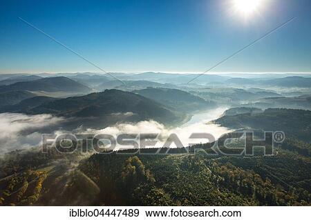 Morning fog over Lake Henne, Meschede, Sauerland, North Rhine-Westphalia, Germany, Europe View Large Photo Image Stock Photo - Morning fog over Lake Henne, Meschede, Sauerland, North Rhine-Westphalia, Germany, Europe. Fotosearch