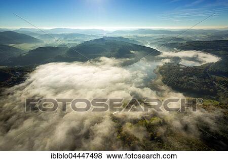 Morning fog over Lake Henne, Meschede, Sauerland, North Rhine-Westphalia, Germany, Europe View Large Photo Image Stock Photo - Morning fog over Lake Henne, Meschede, Sauerland, North Rhine-Westphalia, Germany, Europe. Fotosearch