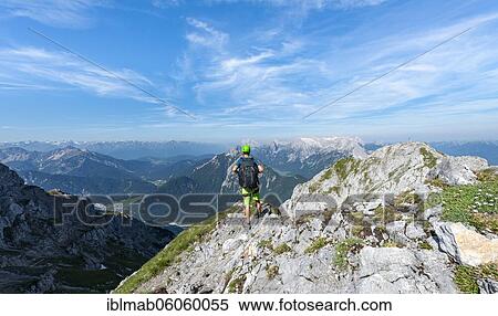 Mountaineer climbs on a secured fixed rope route, Mittenwalder Höhenweg, view into the Isar valley near Mittenwald, Karwendel Mountains, Mittenwald, Bavaria, Germany, Europe View Large Photo Image Stock Photography - Mountaineer climbs on a secured fixed rope route, Mittenwalder Höhenweg, view into the Isar valley near Mittenwald, Karwendel Mountains, Mittenwald, Bavaria, Germany, Europe. Fotosearch