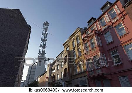 Stock Photo - Municipal utility tower and historic residential buildings in Hochfeld district, Duisburg, Ruhr area, North Rhine-Westphalia, Germany, Europe. Fotosearch