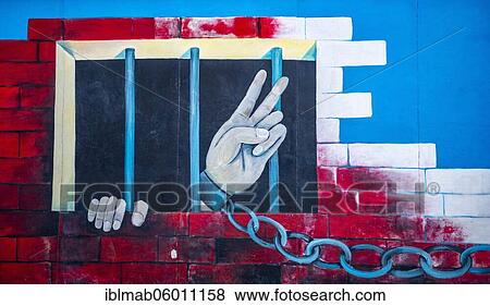 Mural Chained Hand Making Peace Signs from Prison, artist Andrej Smolák, mural at the East Side Gallery, Berlin Wall, Berlin, Germany, Europe View Large Photo Image Stock Photo - Mural Chained Hand Making Peace Signs from Prison, artist Andrej Smolák, mural at the East Side Gallery, Berlin Wall, Berlin, Germany, Europe. Fotosearch