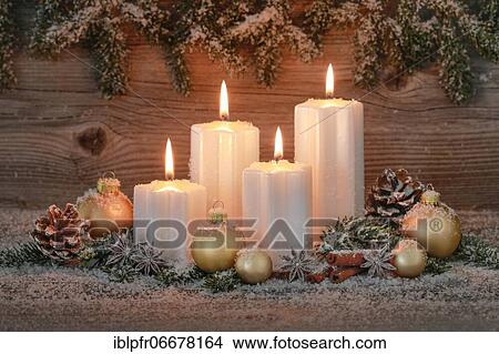 Picture - Natural advent decoration with 4 burning candles. Fotosearch