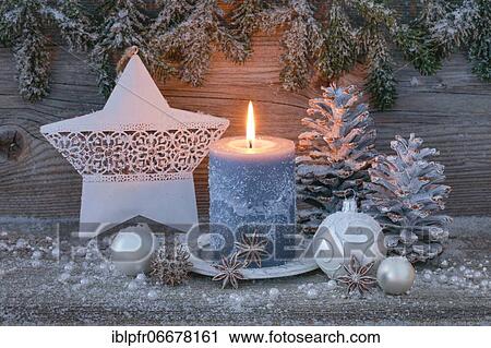 Natural advent decoration with burning candle and star View Large Photo Image Stock Image - Natural advent decoration with burning candle and star. Fotosearch
