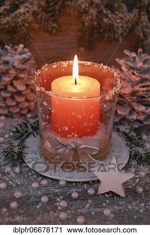Natural advent decoration with burning candle View Large Photo Image Stock Image - Natural advent decoration with burning candle. Fotosearch